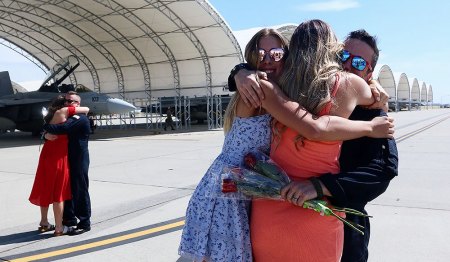 The morning was all about hugs and roses for the families reuniting after a long deployment. 